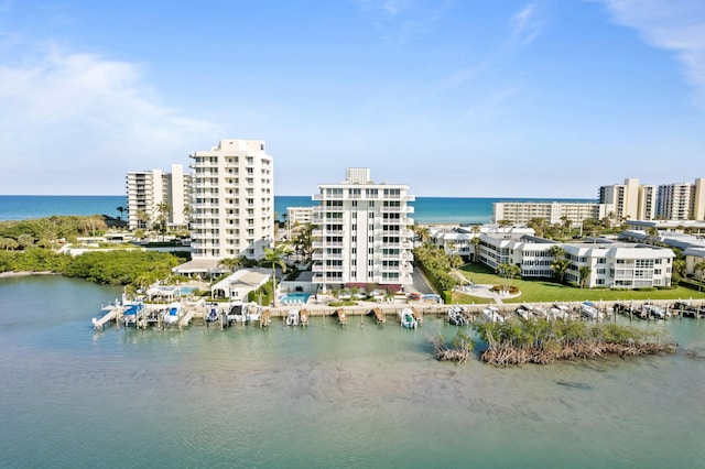 birds eye view of property with a water view