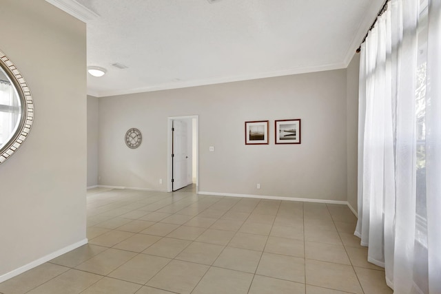 tiled spare room with ornamental molding