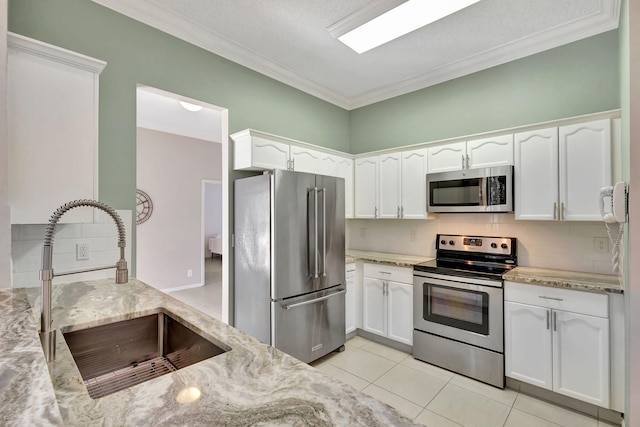 kitchen featuring white cabinetry and appliances with stainless steel finishes