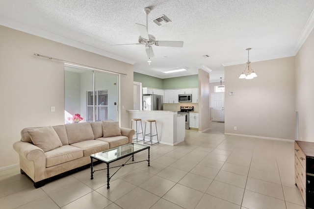 tiled living room with a textured ceiling, crown molding, and ceiling fan with notable chandelier