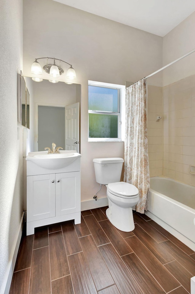 full bathroom with shower / tub combo, vanity, and toilet