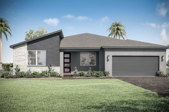 view of front of property featuring a garage and a front lawn