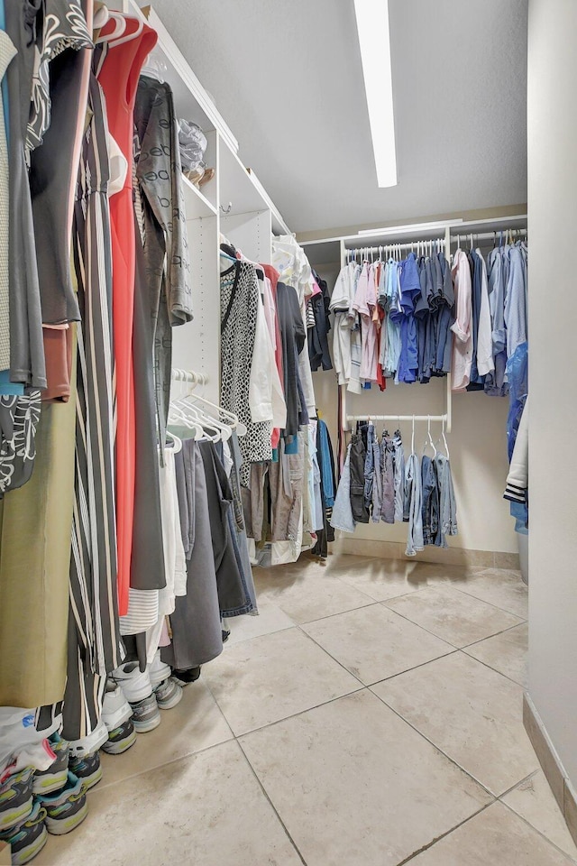 spacious closet with tile patterned flooring