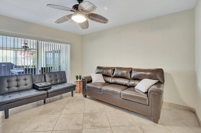 tiled living room featuring ceiling fan