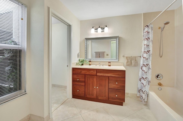 bathroom with tile patterned flooring, vanity, and shower / tub combo