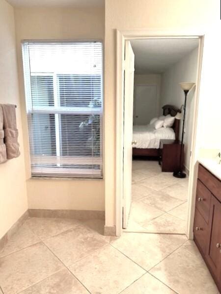 interior space featuring tile patterned floors and vanity