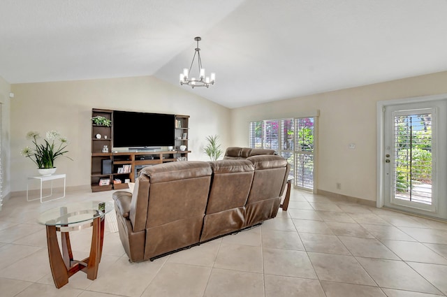 tiled living room with lofted ceiling and a notable chandelier