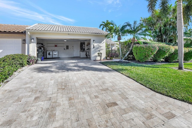 view of home's exterior with a lawn and a garage