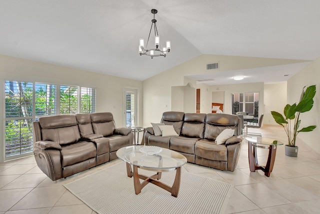 tiled living room with a chandelier and vaulted ceiling