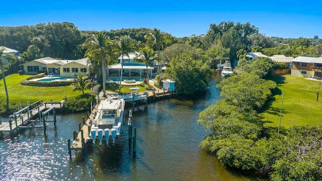 birds eye view of property featuring a water view