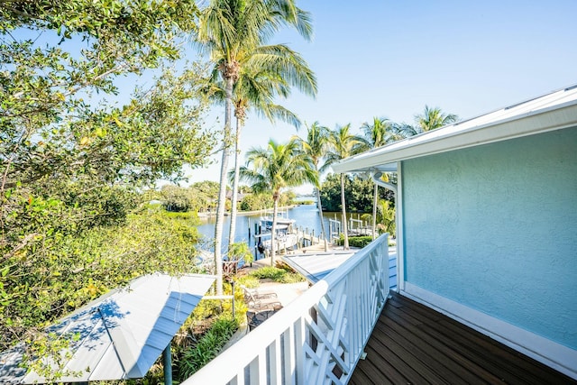 2897 SE Saint Lucie Blvd, Stuart, FL 34997 - balcony featuring a water view and a dock