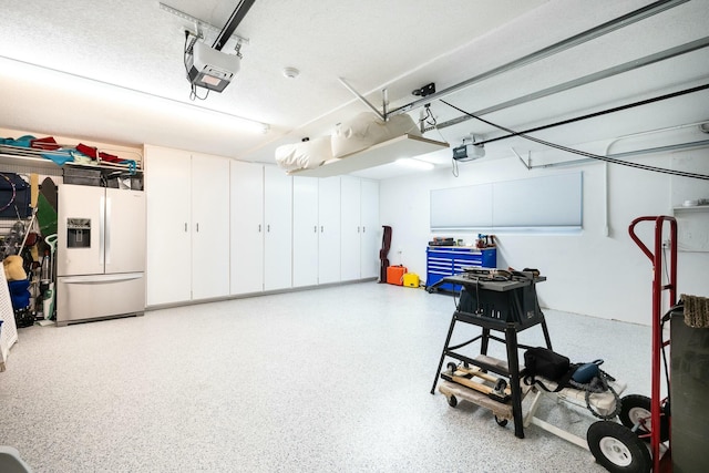 2897 SE Saint Lucie Blvd, Stuart, FL 34997 - garage featuring a garage door opener and refrigerator with ice dispenser