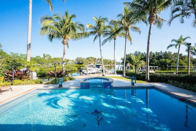 2897 SE Saint Lucie Blvd, Stuart, FL 34997 - view of swimming pool featuring a pool with connected hot tub