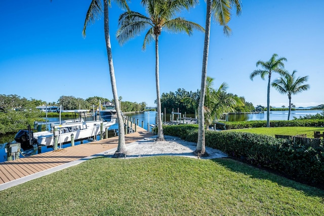 2897 SE Saint Lucie Blvd, Stuart, FL 34997 - dock area with a lawn, a water view, and boat lift