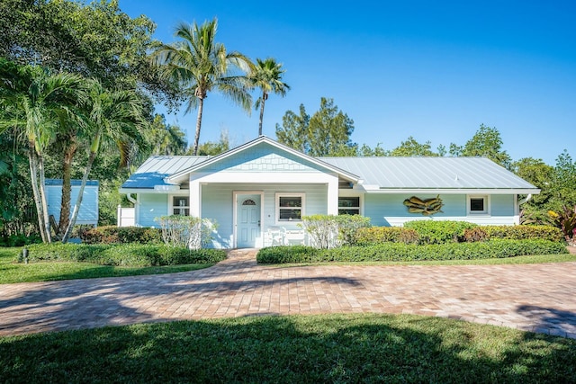 2897 SE Saint Lucie Blvd, Stuart, FL 34997 - view of front of property with covered porch and metal roof