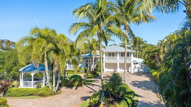 2897 SE Saint Lucie Blvd, Stuart, FL 34997 - view of home's community featuring a gazebo, a garage, and decorative driveway