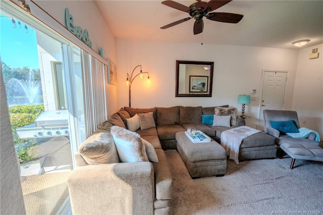 carpeted living room featuring ceiling fan