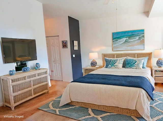 bedroom featuring a closet, ceiling fan, and carpet