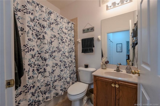 bathroom with vanity, tile patterned flooring, curtained shower, and toilet