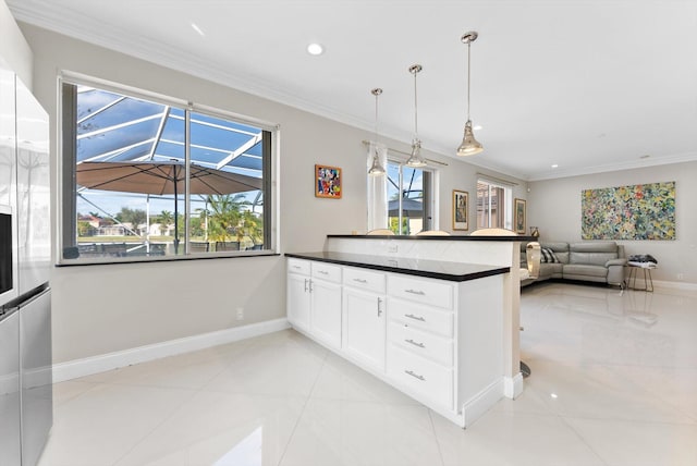 kitchen with white cabinetry, crown molding, hanging light fixtures, and kitchen peninsula