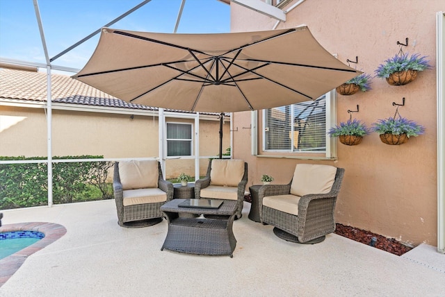 view of patio / terrace featuring a lanai