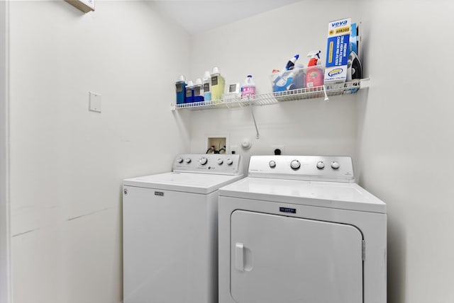 washroom with washing machine and clothes dryer