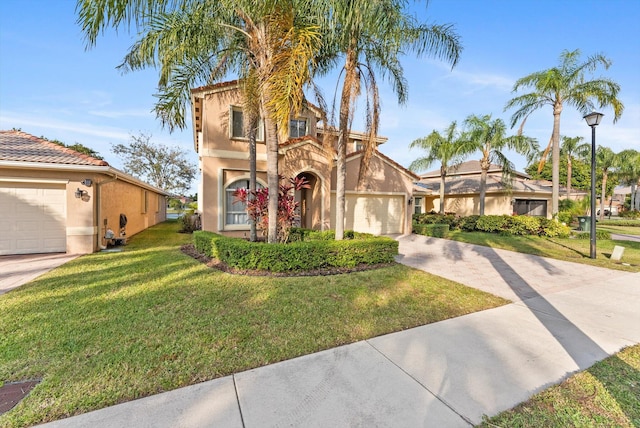 mediterranean / spanish house featuring a front lawn