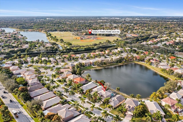 birds eye view of property featuring a water view