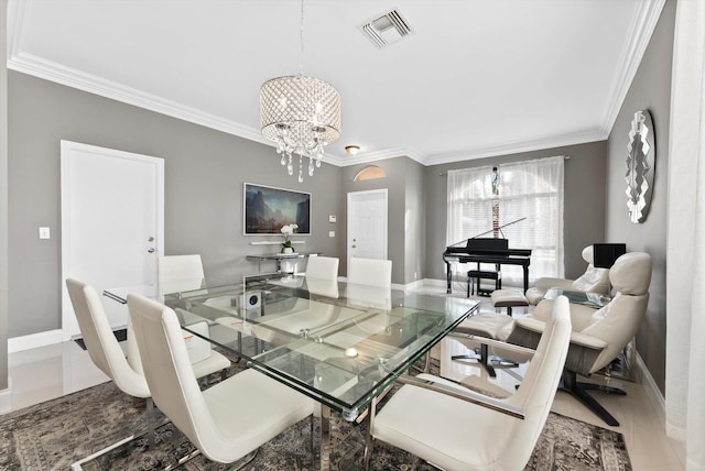 dining area featuring a notable chandelier, tile patterned flooring, and crown molding