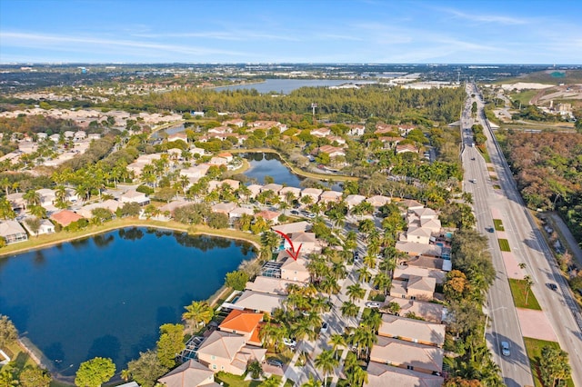 drone / aerial view with a water view