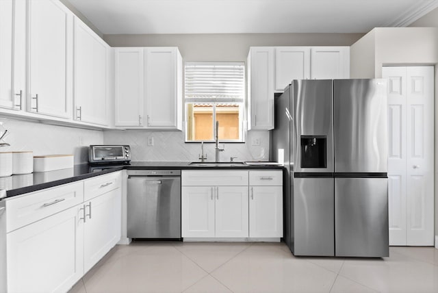 kitchen featuring sink, white cabinets, and appliances with stainless steel finishes