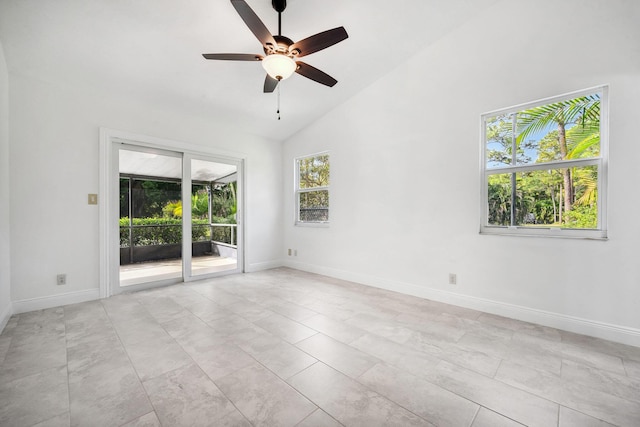 empty room featuring ceiling fan and high vaulted ceiling