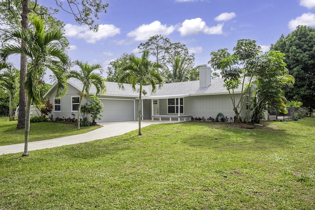 single story home with a garage and a front lawn