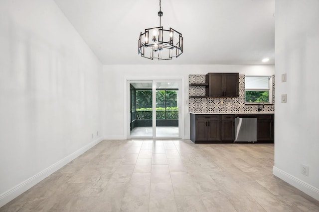 kitchen with dishwasher, a notable chandelier, decorative backsplash, dark brown cabinetry, and hanging light fixtures