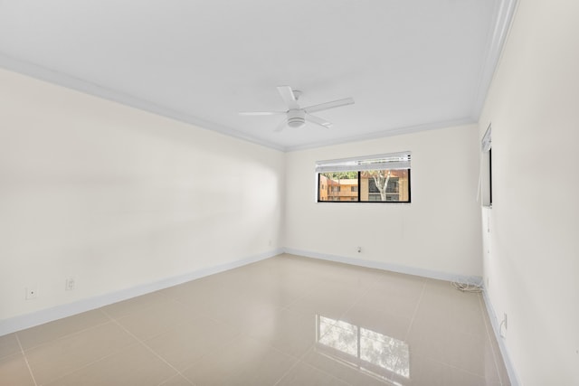 tiled spare room with crown molding and ceiling fan