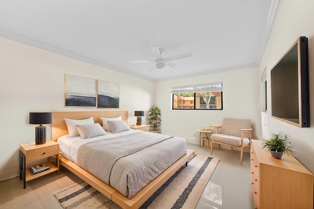 bedroom with ornamental molding and ceiling fan