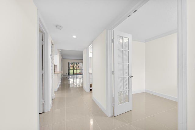 corridor featuring light tile patterned floors