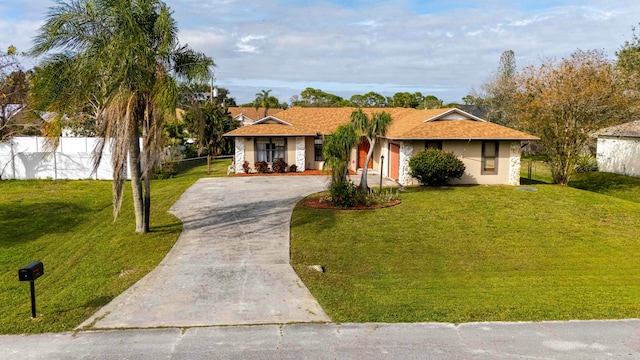 ranch-style house with a front lawn