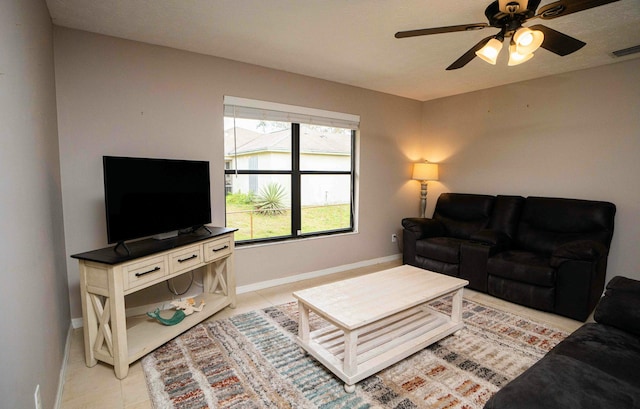 living room with light tile patterned flooring and ceiling fan