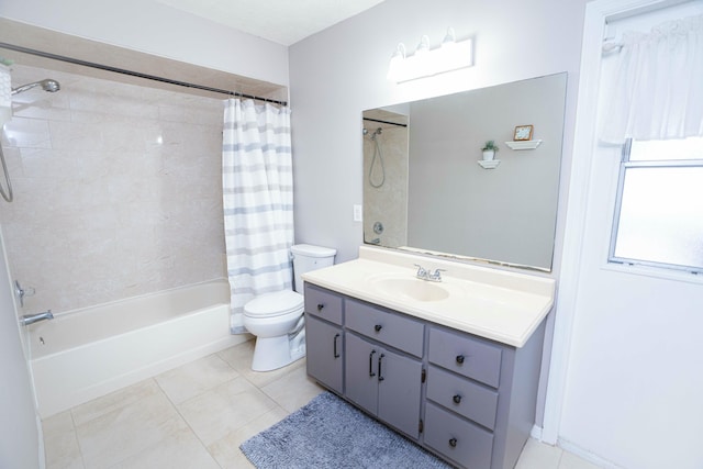 full bathroom featuring toilet, tile patterned floors, vanity, and shower / bathtub combination with curtain