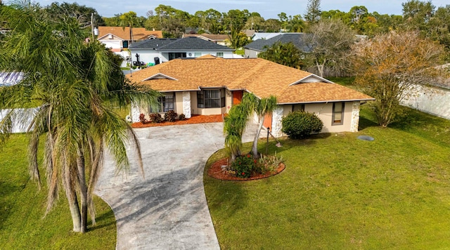 ranch-style house featuring a front lawn