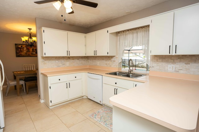 kitchen featuring white cabinetry, dishwasher, sink, and backsplash