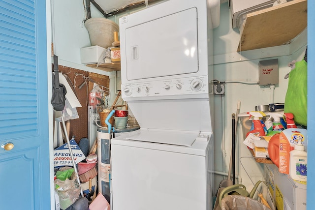 laundry area with stacked washer and clothes dryer