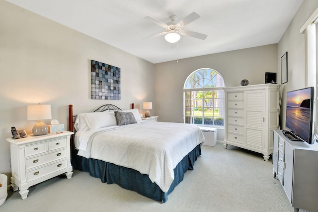 bedroom with light carpet and ceiling fan