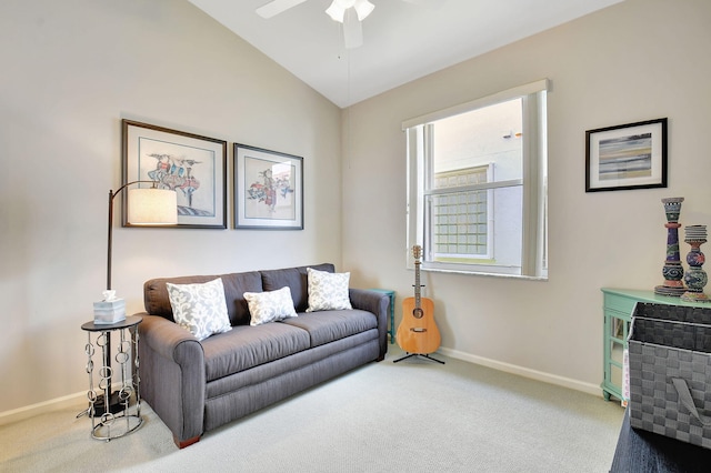 carpeted living room featuring ceiling fan and vaulted ceiling