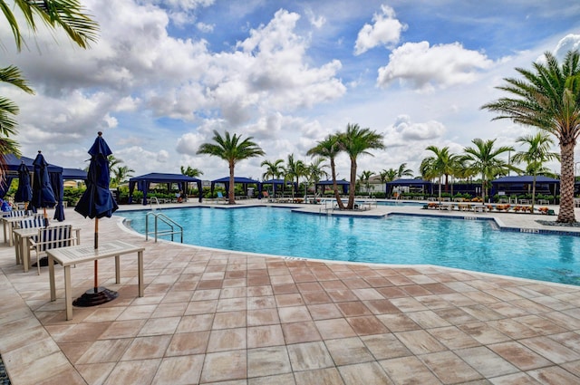 view of swimming pool featuring a gazebo and a patio