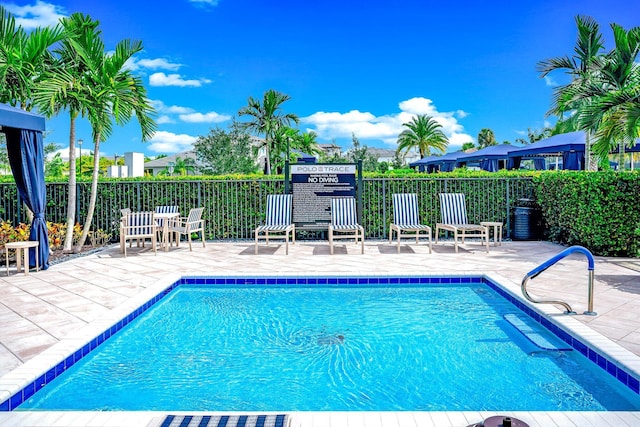 view of swimming pool with a patio area