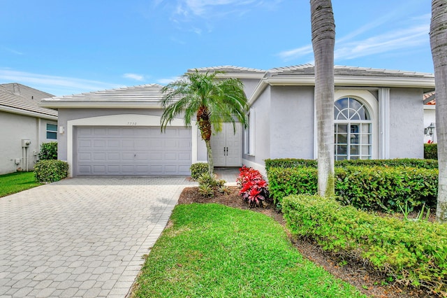 single story home featuring a garage