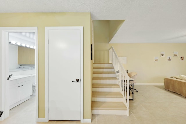 stairway featuring tile patterned flooring