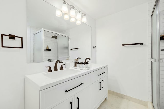 bathroom with walk in shower and vanity